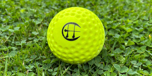hurling holder yellow speedball on grass