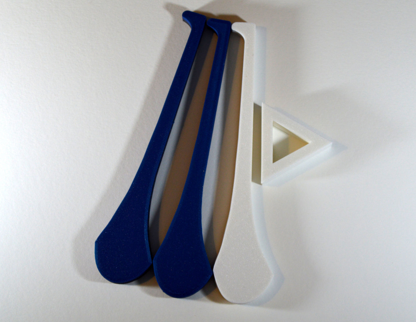 A display stand with a small hurley board, featuring blue and white colour