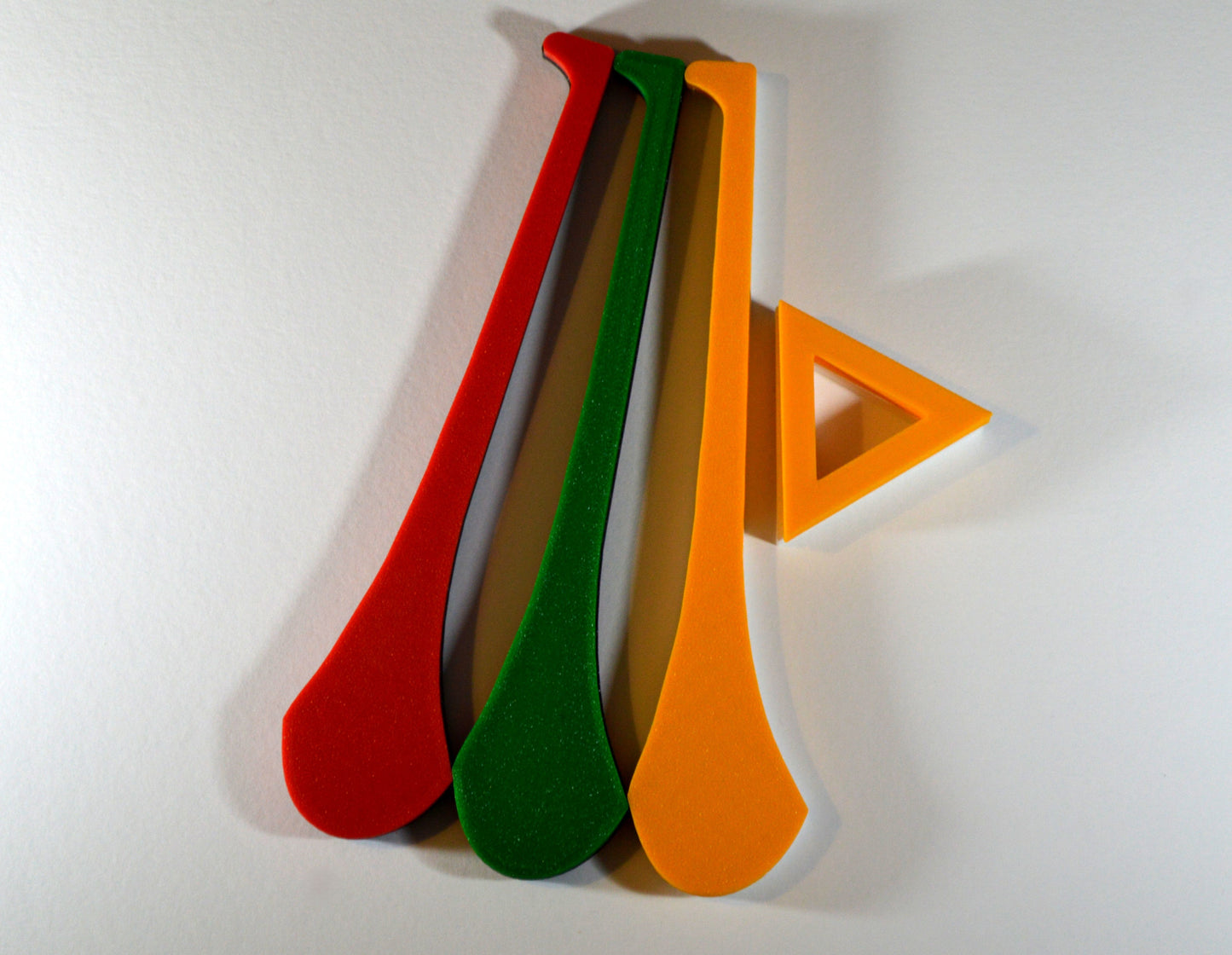 A display stand with a small hurley board, featuring green, red and yellow colour