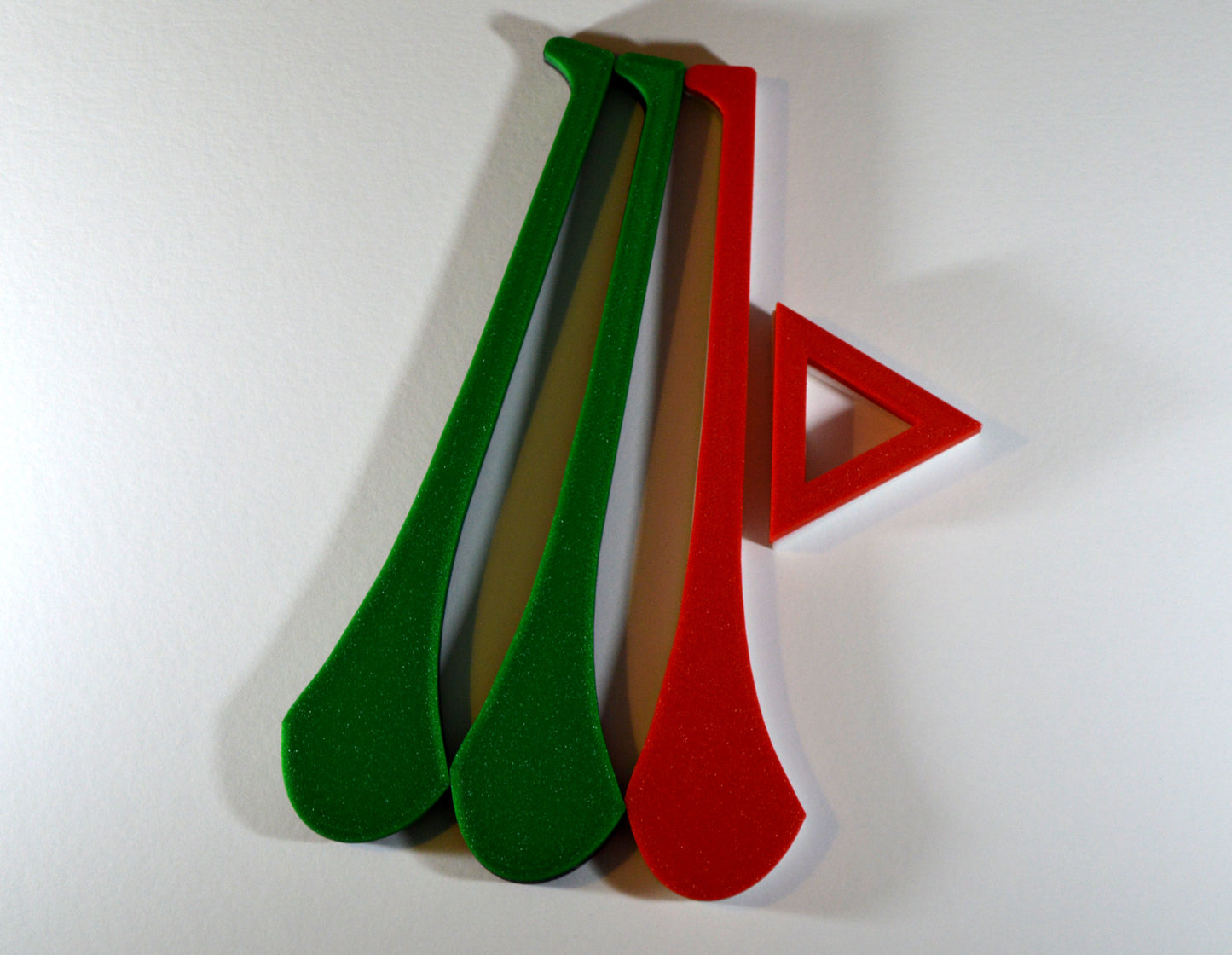 A display stand with a small hurley board, featuring green and red colours