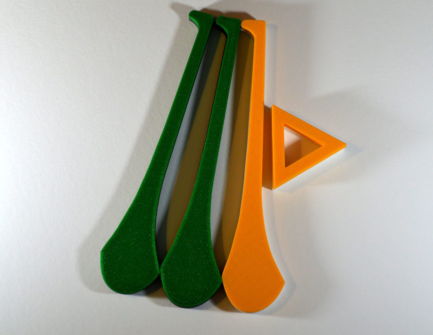 A display stand with a small hurley board, featuring green and yellow colours