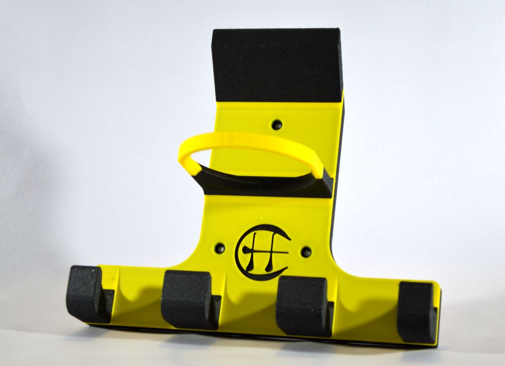 Black and amber triple hurling holder on a white background