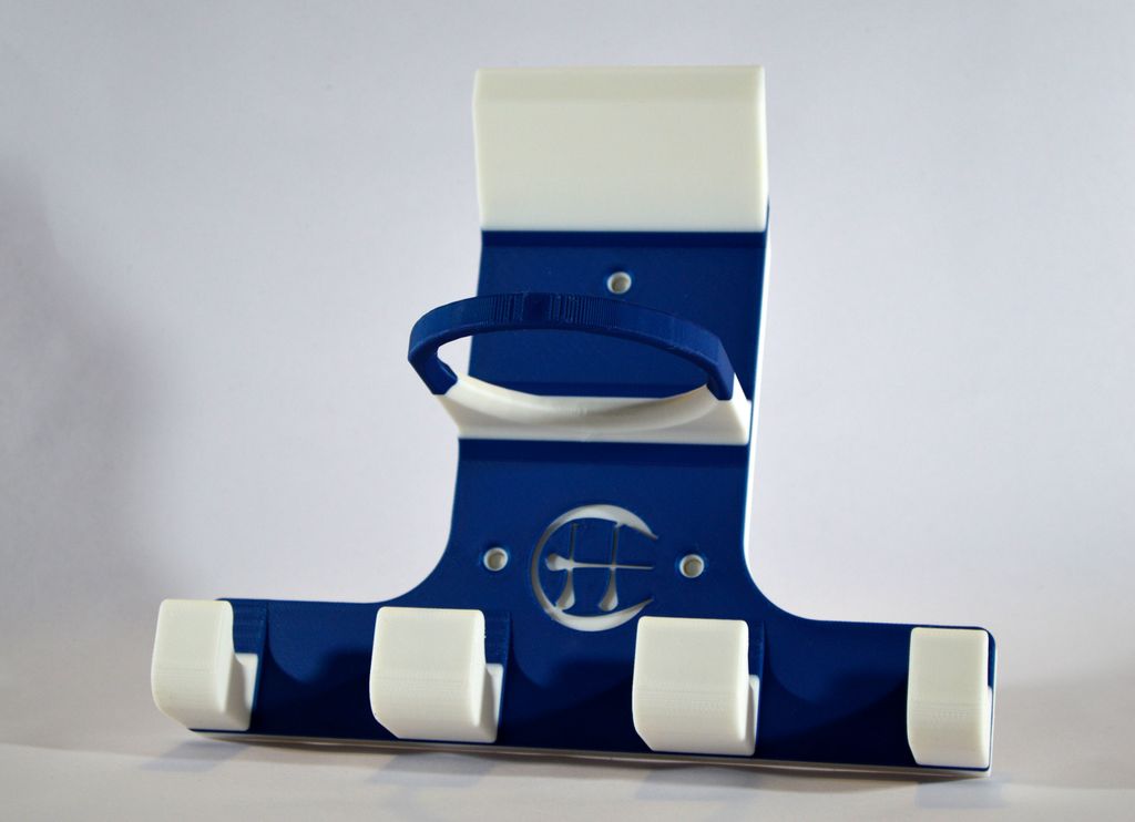 A blue and white triple trinity hurley holder designed to hold equipment for the sport of hurling, featuring hooks for a helmet, sliotar, and multiple hurleys.