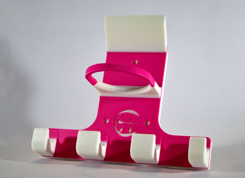A pink and white triple hurling holder