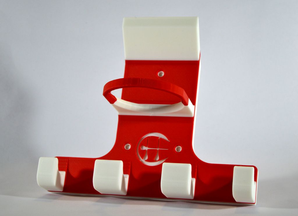 A red and white triple trinity hurley holder designed to hold equipment for the sport of hurling, featuring hooks for a helmet, sliotar, and multiple hurleys.