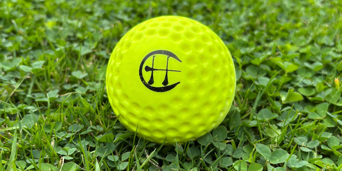hurling holder yellow speedball on grass 