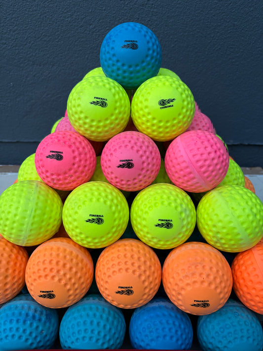 Assorted colorful speedballs on a dark surface