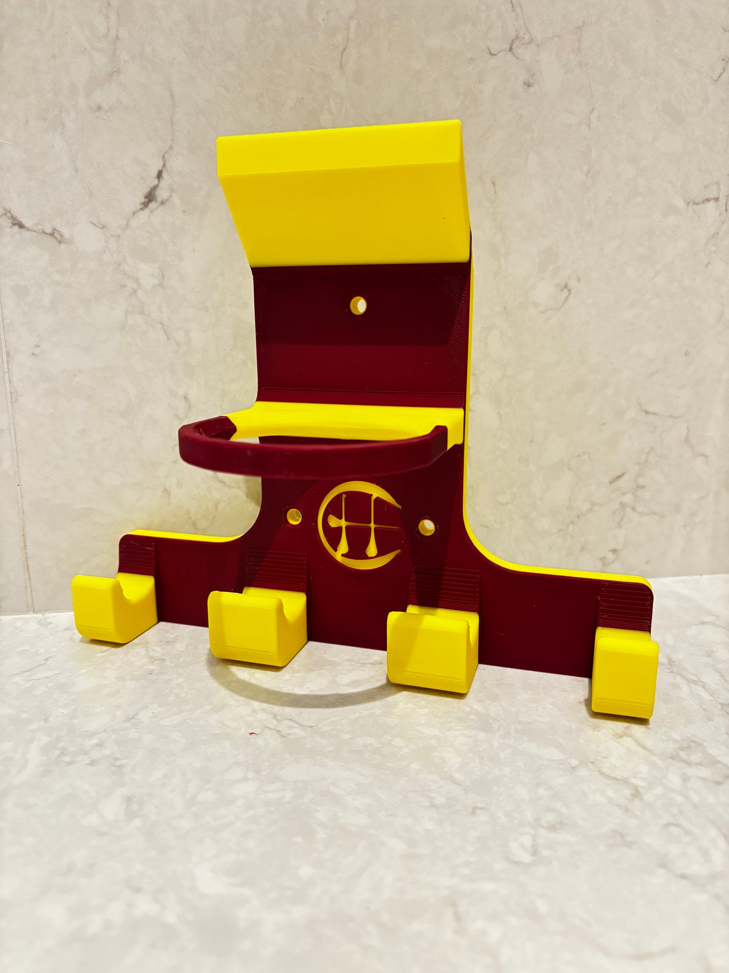 Yellow and maroon wall hurling holder on white background