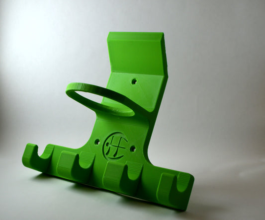 A green triple trinity hurley holder designed to hold equipment for the sport of hurling, featuring hooks for a helmet, sliotar, and multiple hurleys.
