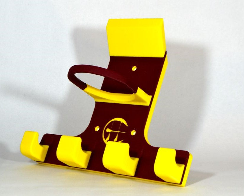 A 3D-printed custom hurling and camogie holder in maroon and yellow photographed against a grey background