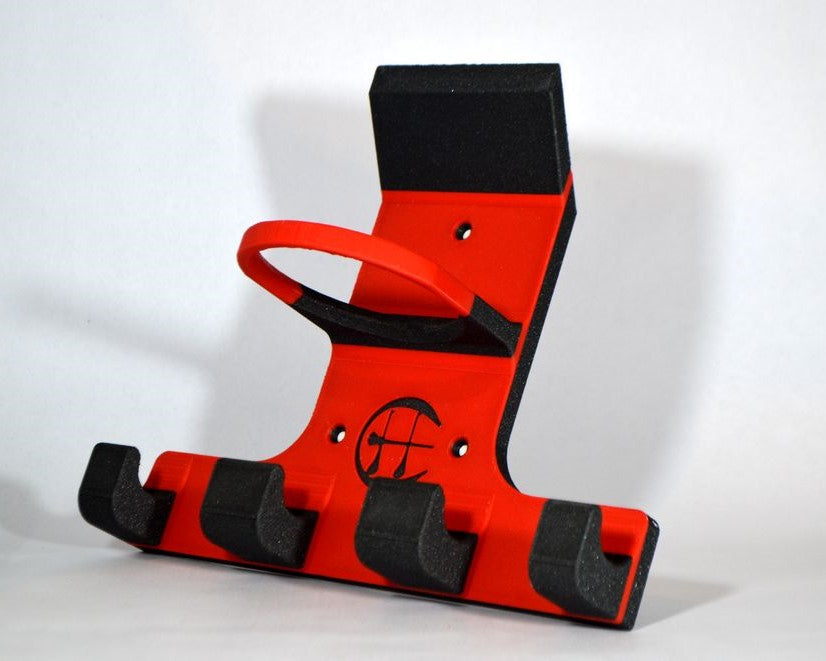 A red and black plastic hurling and camogie holder, photographed against a plain light background.