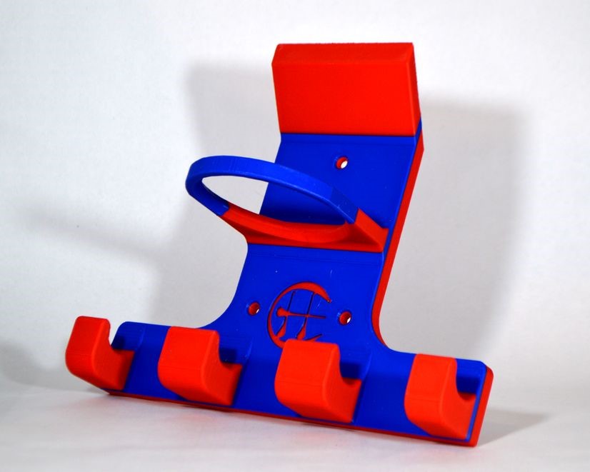 A red and blue plastic hurling and camogie holder, photographed against a plain light background.