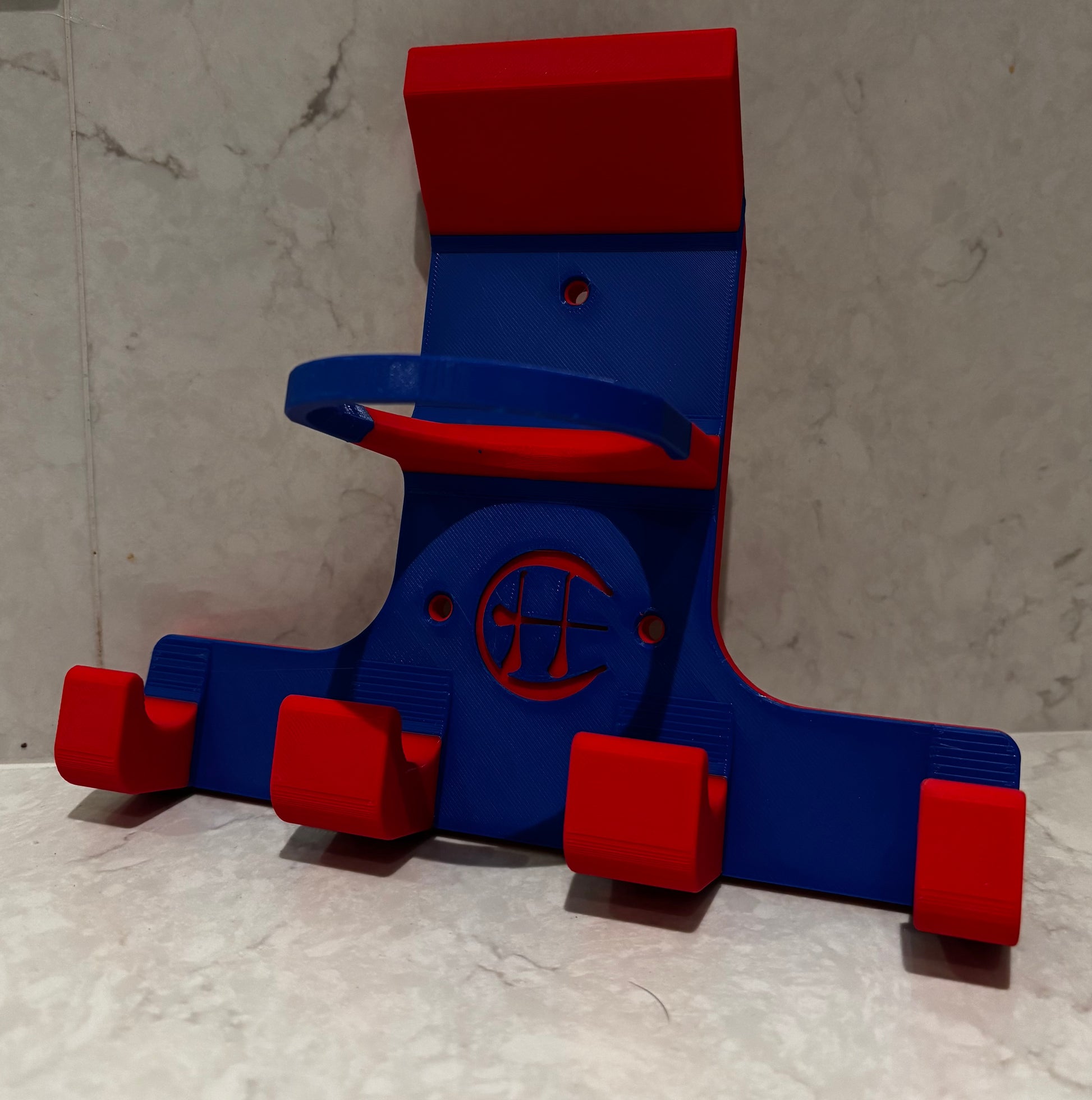 Red and blue wall hurling holder on white background