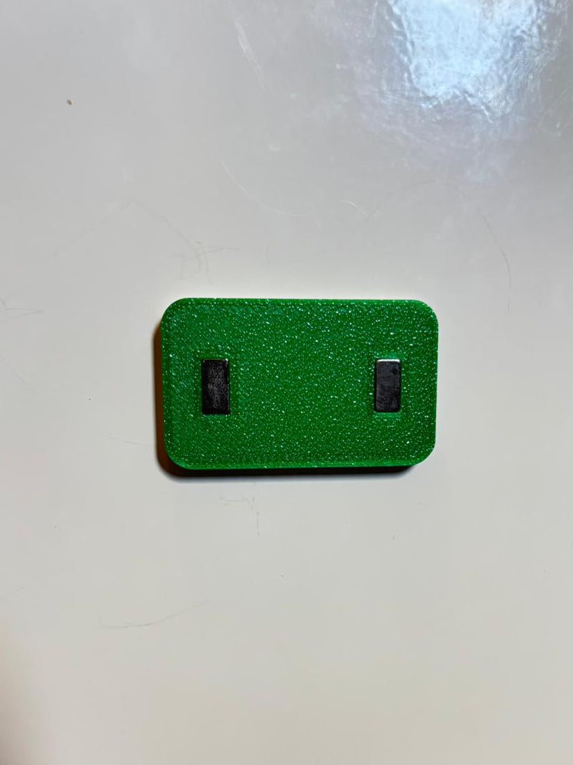 the back of a magnet holder showing 2 magnets